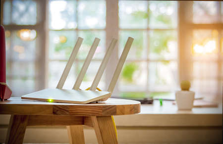 Closeup of a wireless router on living room at homeの写真素材