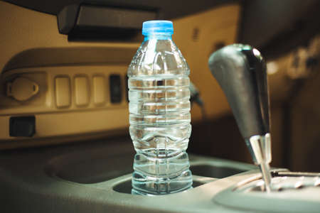 In the car  is a bottle of water, for the driverの写真素材