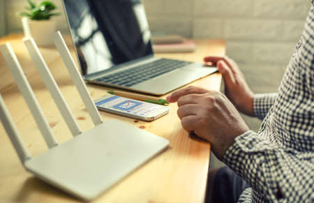 man hand using mobile phone with e-mail applicationの写真素材