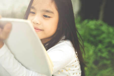 Asian young girl read a bookの写真素材