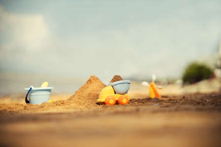 kids toys on tropical sand beachの写真素材