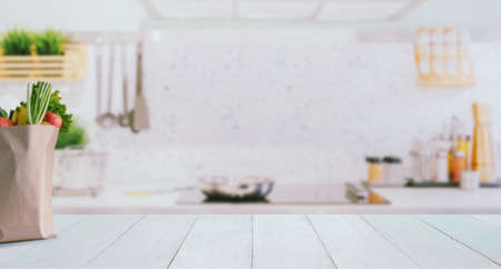 Wood table top on blurred kitchen background,の写真素材