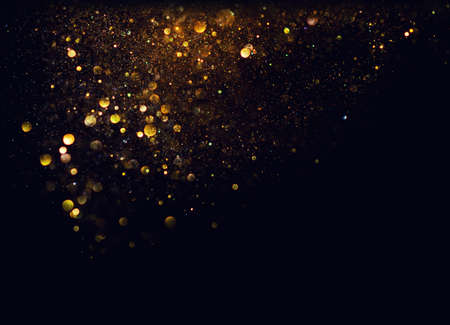 glitter vintage lights background. gold and black. de focusedの写真素材