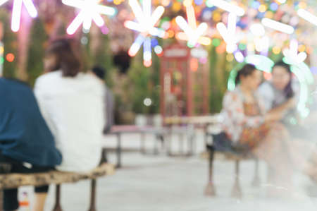 Abstract blur image of flea market and people at night with bokeh for backgroundの写真素材