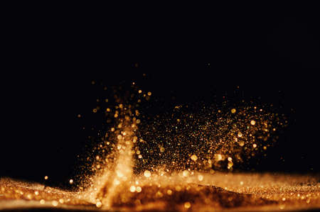 glitter vintage lights background. gold and black. de focusedの写真素材