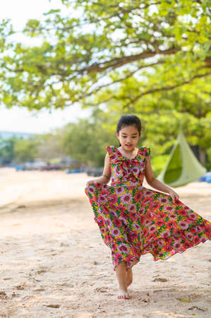 asian girl relaxing on the sea coast. Summertimeの写真素材