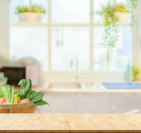 Wood table top on blurred kitchen background,の写真素材