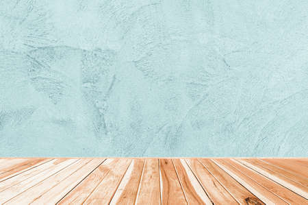 wood table on Abstract Grunge Decorative Rough Uneven Navy Blue Stucco Wall Background,  interior design or montage display your productの写真素材