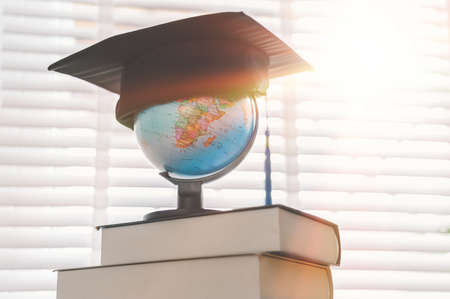 Graduation cap on top of the globe, education concept design