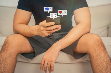Hand using smart phone with Social media conceptの写真素材