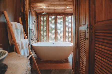 Beautiful luxury white bathtub decoration in bathroom interior for relax leisureの写真素材