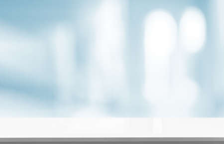 Wood table top on BLURRED OFFICE BACKGROUNDの写真素材