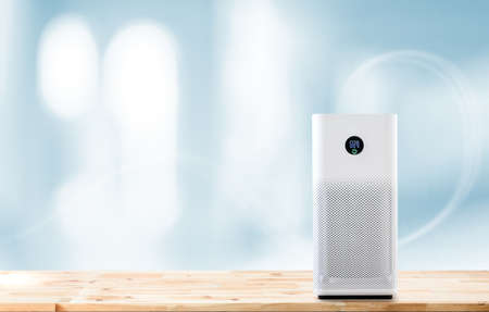 air purifier a living room,  air cleaner removing fine dust in house. protect PM 2.5 dust and air pollution conceptの写真素材