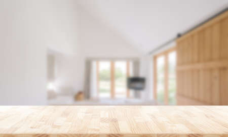 Wooden table top in front of blurred bedroom interior background.  for montage or display your productsの写真素材