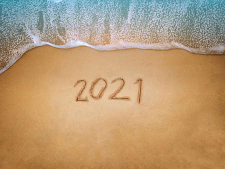 Happy New Year 2021, lettering on the beach with wave and blue sea. Numbers 2021 year on the sea shore, New Years concept.の写真素材