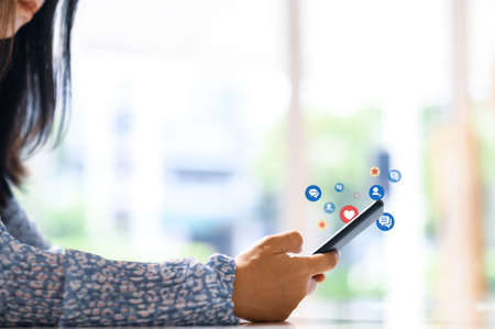 Hand using smart phone with Social media conceptの写真素材