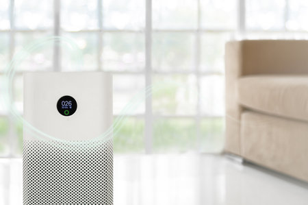 air purifier a living room,  air cleaner removing fine dust in house. protect PM 2.5 dust and air pollution conceptの写真素材
