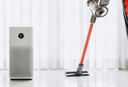 air purifier a living room,  air cleaner removing fine dust in house. protect PM 2.5 dust and air pollution conceptの写真素材