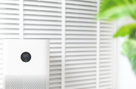 air purifier a living room, air cleaner removing fine dust in house. protect PM 2.5 dust and air pollution conceptの写真素材