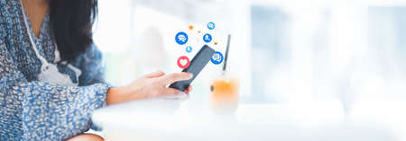Hand using smart phone with Social media concept