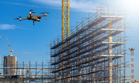 Drone over construction site. video surveillance or industrial inspectionの写真素材