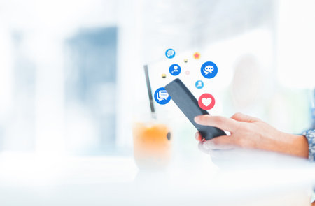 Hand using smart phone with Social media conceptの写真素材