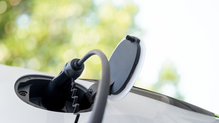 ev charging station for electric car in concept of green energy and eco power produced from sustainable source to supply to charger station in order to reduce co2 emissionの写真素材