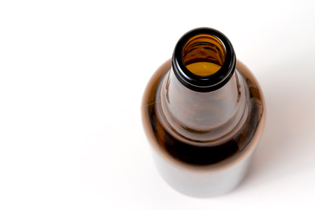 Empty brown beer bottle on a white backgroundの写真素材