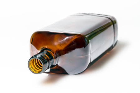 Empty rectangular brown bottle on a white background, closeup of photoの写真素材