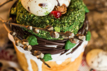 Easter pie in eco-style decorated in the form of a nest with eggs on the background of the national...