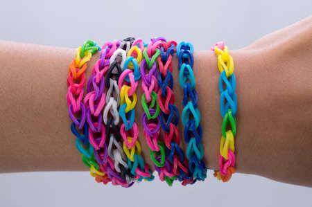 Colorful handmade wrist bands from hair lacesの写真素材