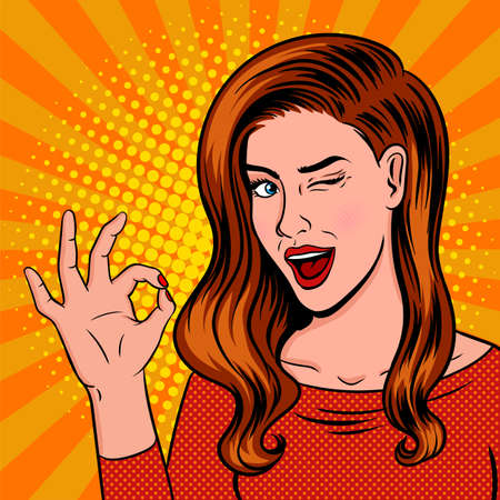 Winking girl pop art. Showing OK sign with speech bubble. Hint and flirting. Vector illustration in comic style. Vintage advertising poster.のイラスト素材