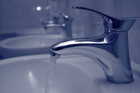 Water tap with a stream of waterの写真素材