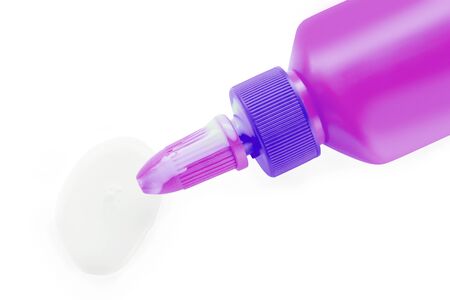 glue bottle with glue drop isolated on white の写真素材