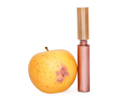 lip gloss applied to the apple isolated on white with clipping pathの写真素材