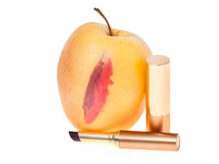 apple with two different lipsticks isolated on white with clipping pathの写真素材