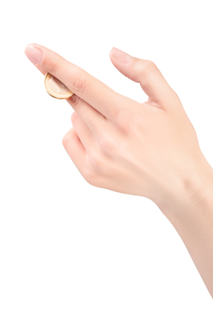 female hand with one euro coin isolated on white with clipping pathの写真素材