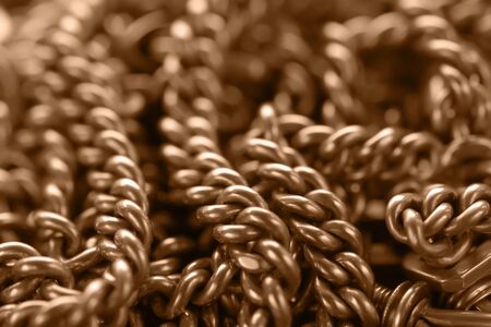 Blurred toned background with ancient golden chainの写真素材