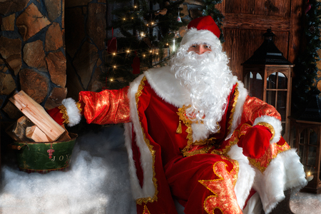 Ded Moroz (Father Frost) - traditional Christmas character sitting on the porchの写真素材