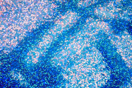 Background with colored underwater sand. Aquarium, sea or pool bottomの写真素材