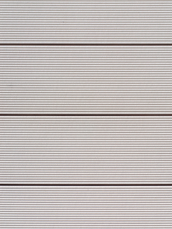 Striped white wall tiles texture. Fragment of lined wallの写真素材