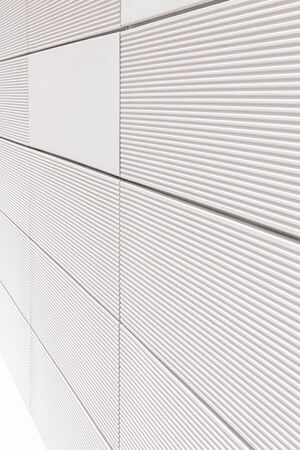 Perspective view of white wall with striped ceramic tiles