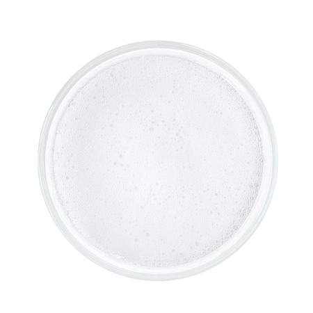 Top view of white sparkling tonic water with bubbles and foam.の写真素材