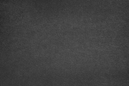 Black cardboard sheet close up. For texture or backgroundの写真素材