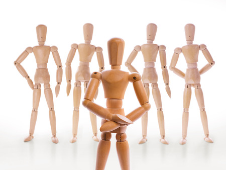 Wooden dummy characters. Head and his team, team leader, hierarchy or leadership conceptの写真素材