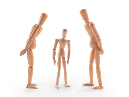 Scene with three wooden dummies. Concept of parents scolded  his children or children fault. Isolated on whiteの写真素材