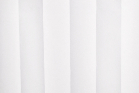 Folded paper background. Horizontal sheet with vertical foldsの写真素材