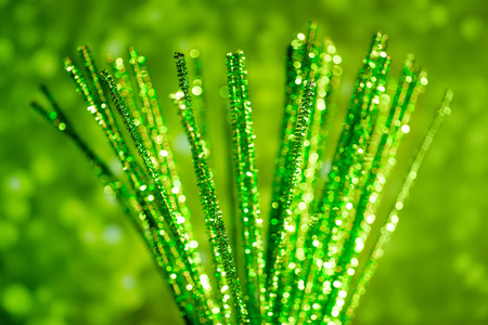 Green christmas blurred abstraction with defocused glitters and christmas decorationの写真素材