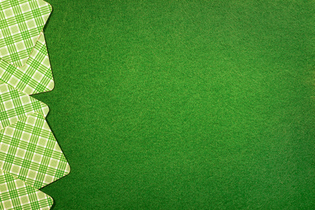 Background with cards on green felt casino table. Copy space on felt fieldの写真素材