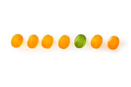 Row of small candies. Isolated on whiteの写真素材